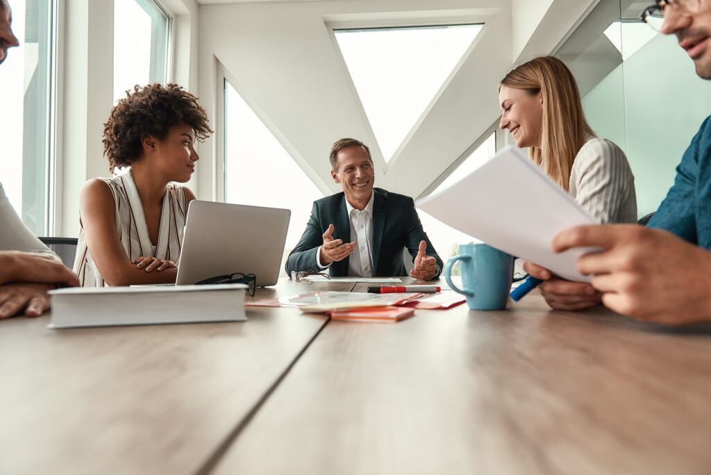 a group of medical billers consults with a potential client